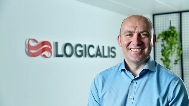 Bob Bailkoski smiling with Logicalis’ logo in the background 