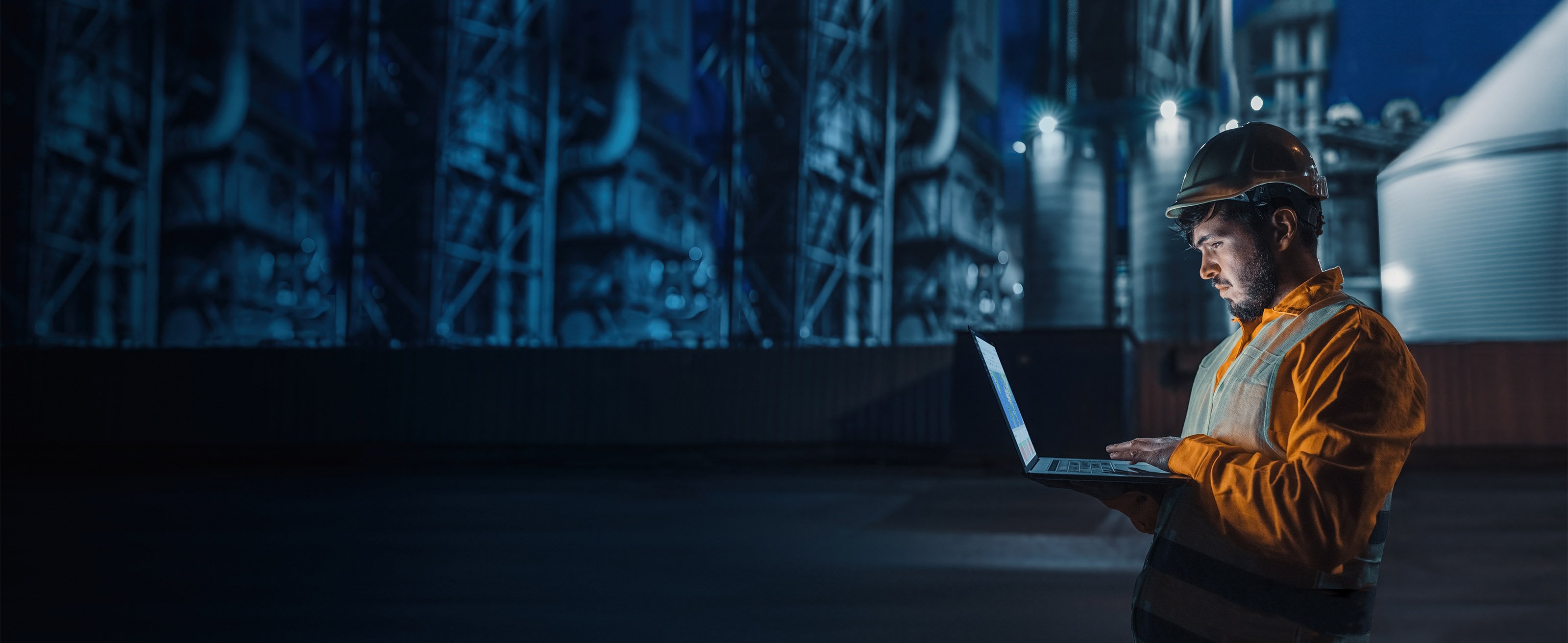 Industrial factory worker using laptop